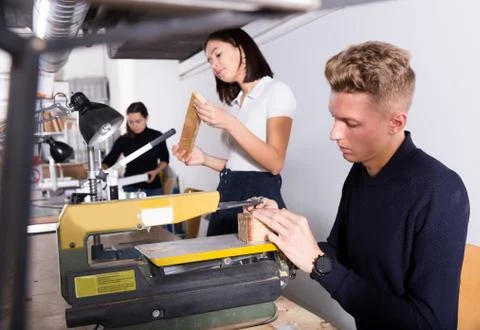 Architect making details for architectural model on fretsaw 스톡 사진