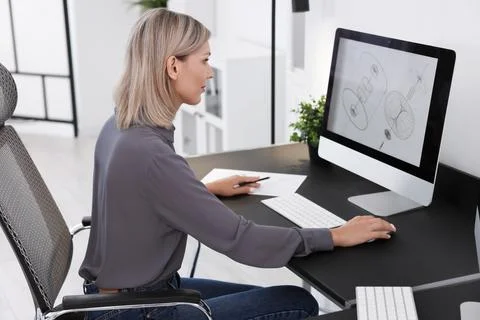 Architect making digital engineering drawing on computer at table in office Stock Photos