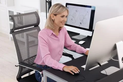 Architect making digital engineering drawing on computer at table in office Stock Photos