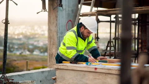Architect, man and blueprint on rooftop of construction site for engineering Stock Footage 336220854