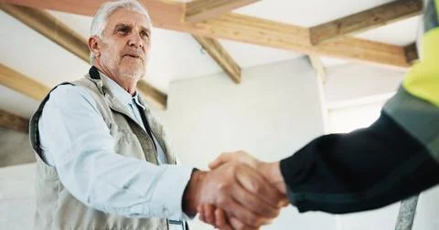 Architect, man and handshake on construction site with worker, approval and.. Stock Photos