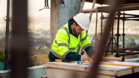 Architect, man and planning on rooftop of construction site for engineering Stock Footage 336225029