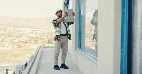 Architect, man and tablet on construction site for building, inspection or Foto stock