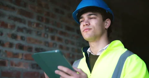 Architect, man and thinking at construction site with tablet, plan and check Stock Footage 337029332