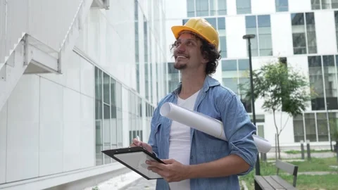 Architect man construction engineer worker or inspector stand outdoors Stock Footage 248171776