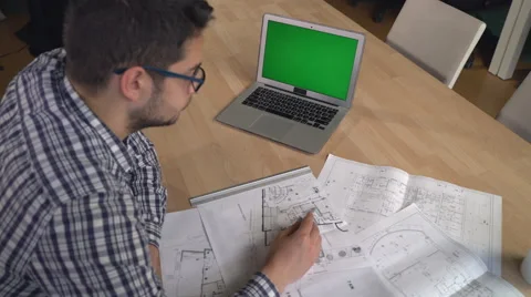 Architect man correct design on blueprint in the office 動画素材 64448530