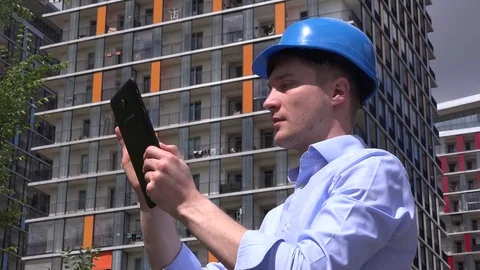 Architect man working on tablet real estate developer on site smiling to camera Stock Footage 77017144