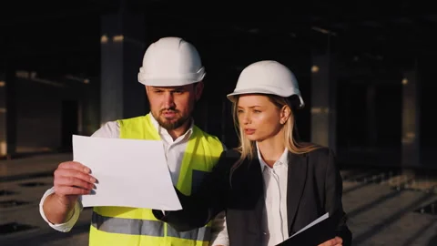 Architect manager chief contractor or construction supervisor are discussing the Video stock 246110727