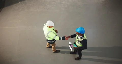 Architect, men and handshake with supervisor in building, teamwork or agreement Stock Footage 341466719