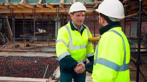 Architect, men and shake hands for construction with collaboration, renovation Stock Footage 336201511