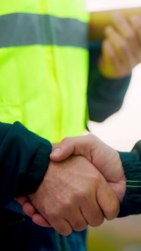 Architect, men and shake hands for partnership in construction with Stock Footage 336209269