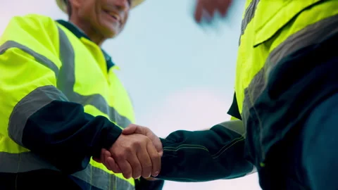 Architect, men and shaking hands for construction with collaboration, renovation Stock Footage 336220044