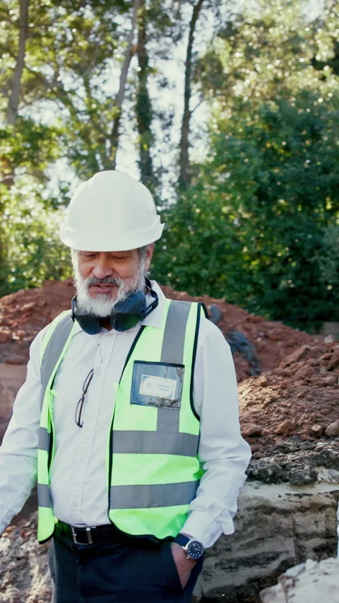 Architect, men and walk at construction site with inspection, helmet and advice Stock Footage 340451138