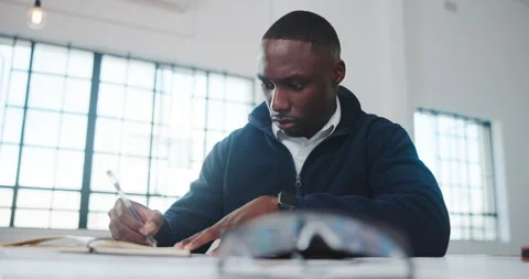 Architect, notebook or black man in agency with writing, design plan or draft of Stock Footage 341464943