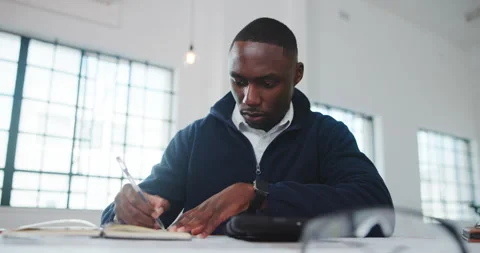 Architect, notebook or black man in office with writing, design plan or draft of Stock Footage 341465025