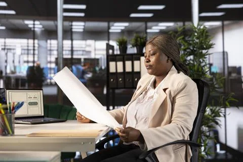 Architect in office designing and developing architectural plans Stock Photos