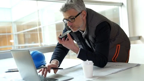 Architect in office talking on mobile phone Stock-Footage 86464210