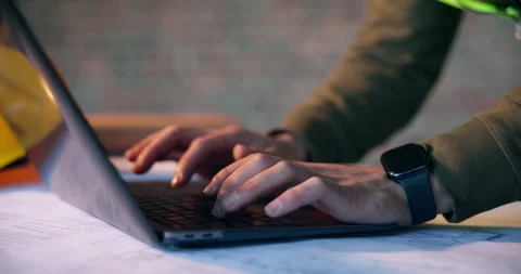 Architect, online and hands with laptop on construction site, info and plan for Stock Footage 337014527