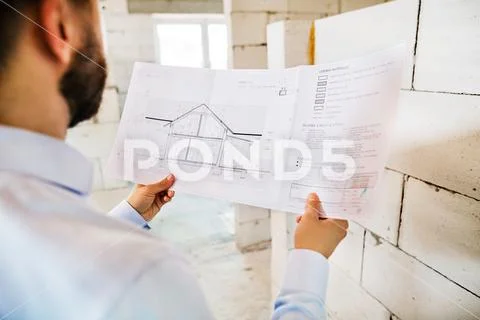 Architect or civil engineer at the construction site. Stock Photos