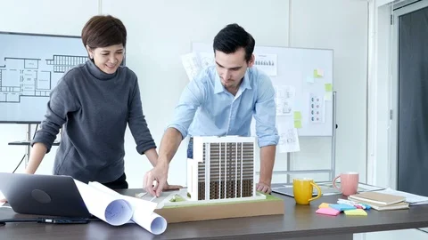 Architect or engineer is concentrating as he examines the new building project. Video stock 91268665