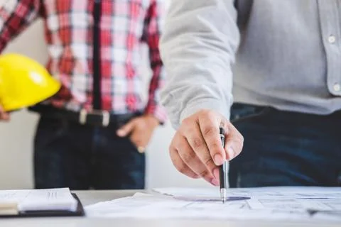 Architect or Engineer meeting working with partner on blueprint for architect Stock Photos