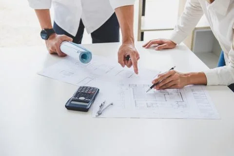 Architect or Engineer meeting working with partner on blueprint for architect Stock Photos