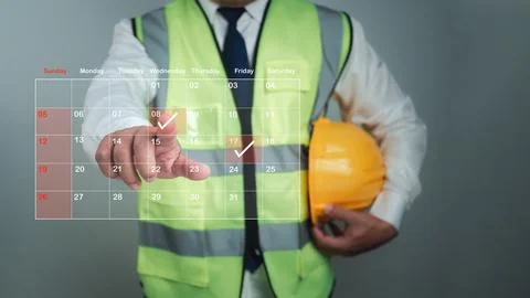 Architect or engineer Pointing finger at construction marking dates on virt.. Stock Photos