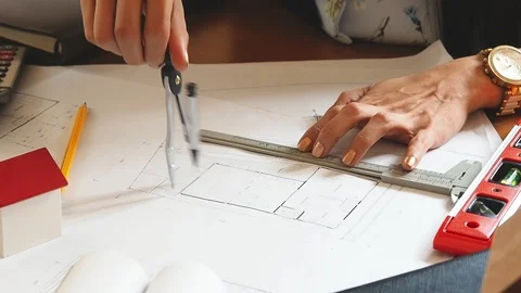 Architect or engineer uses divider gauge on the blueprint. architectural concept Stock Footage 107427288