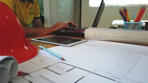 Architect or engineer using laptop for working at desk in office. Stock Footage 119530517