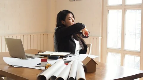 Architect or engineer woman stretch and relax from fatigue after work all day Stock Footage 112712944