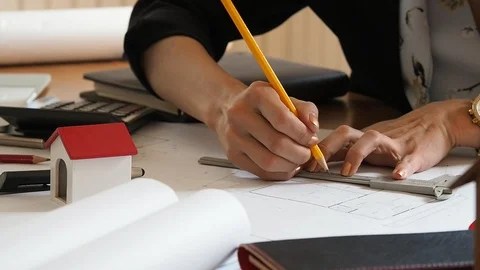 An architect or engineer working on blueprint, architectural concept. Stock Footage 104351816