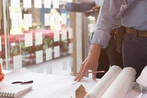 Architect or engineer working with blueprints in office, Construction concept Fotos de archivo