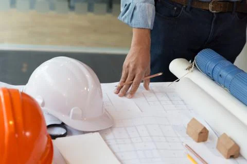 Architect or engineer working with blueprints in office, Construction concept Fotos de archivo