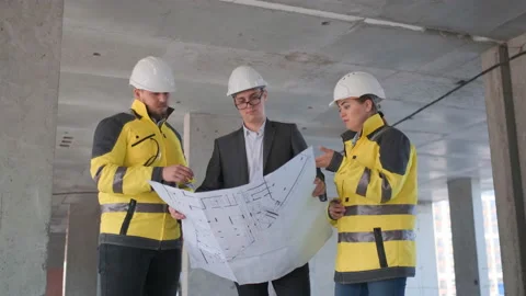 Architect or engineer working, browsing building project indoor of construction Video stock 114530025