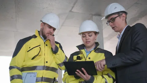 Architect or engineer working, browsing building project indoor of construction Video stock 114535776