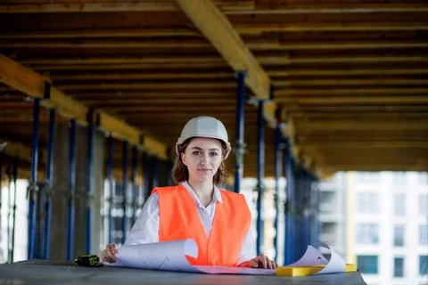 Architect or engineer working, browsing building project indoor of constructi Stock Photos