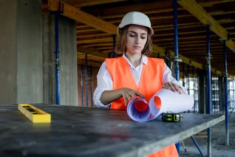 Architect or engineer working, browsing building project indoor of construc.. Stock Photos