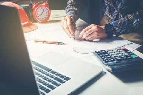 Architect or engineer working in office on blueprint. Architects workplace .. Foto stock