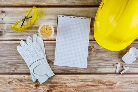 Architect or engineer working on spiral notepad architecture mode in office c Stock Photos