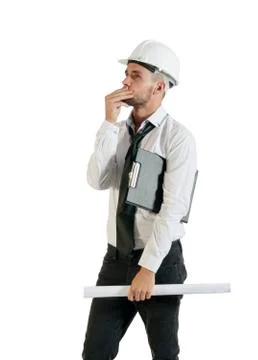 Architect or structural engineer with site plans in a hard hat. Stock Photos