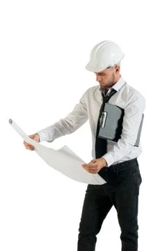 Architect or structural engineer with site plans in a hard hat. Stock Photos