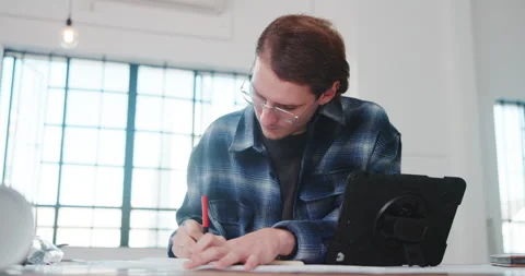 Architect, paper and man in office with writing, design plan and draft of Stock Footage 341478045