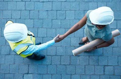 Architect partnership, client handshake and construction worker meeting at Stock Photos