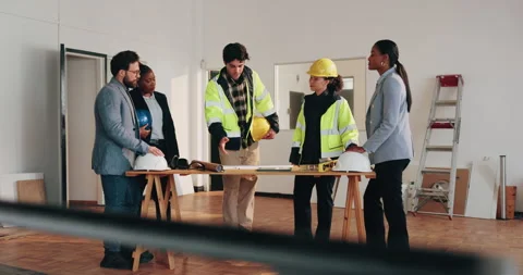 Architect, people and discussion with team in building, pointing or planning for Stock Footage 341586854