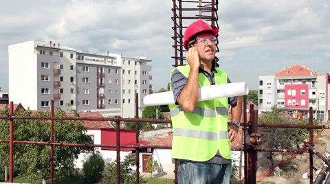 Architect With Personal Protective Equipment Using Cell Phone Stock Footage 34160603