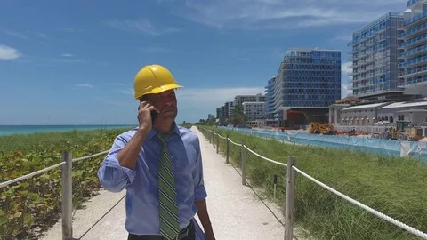 Architect on the phone by a construction site Stock Footage 70610268