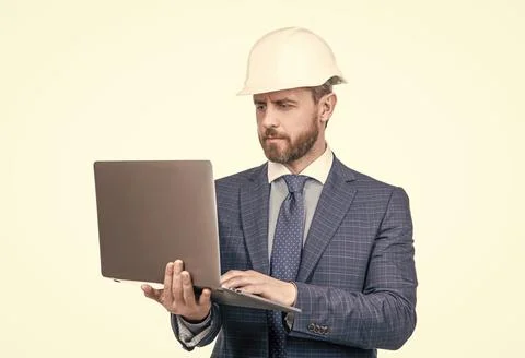 Architect planning work. chief engineer in hardhat use computer. mature ceo Stock Photos