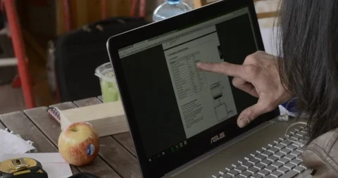 Architect Pointing At Plans And Working On Computer Stock Footage 119698622