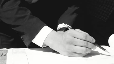 Architect Pointing at Technical Drawing with Pencil Stock Footage 333347318