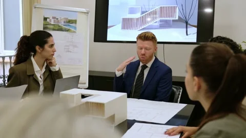 Architect presenting new building project to colleagues Stock Footage 343927794